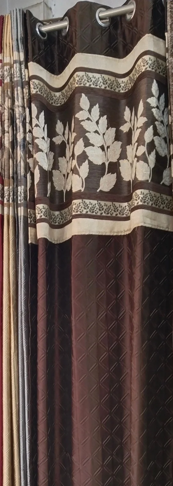 brown curtain with leafy border