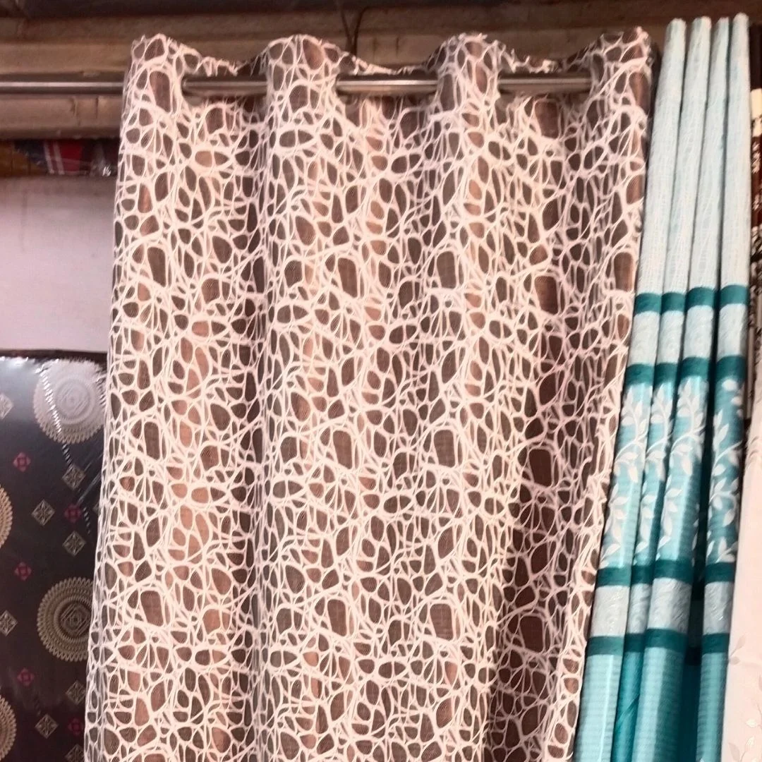 brown curtains with white loops designed