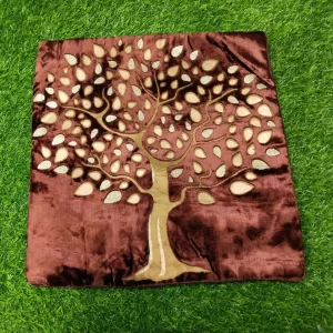 Browm velvet cushion covers with golden tree print on it