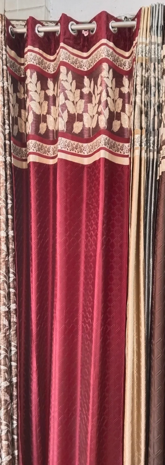 red curtains with flowery design border