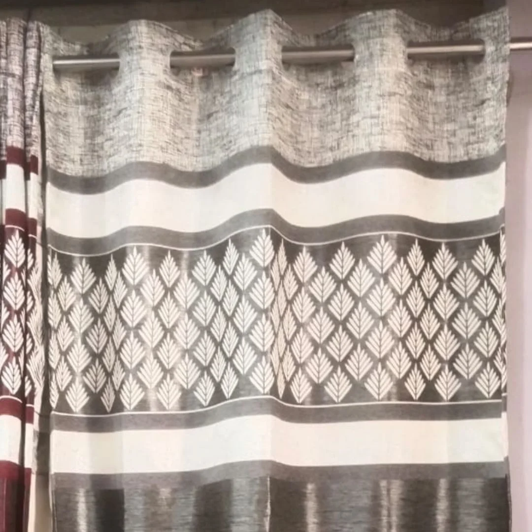 Grey curtains, jute fabric, with golden shine on this